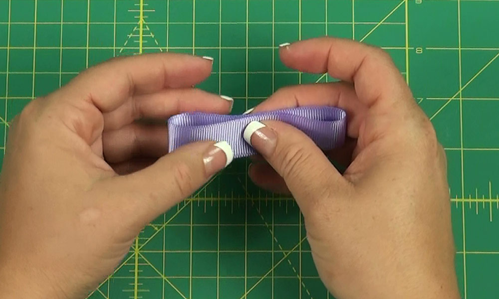 Woman making a Tailored Bow