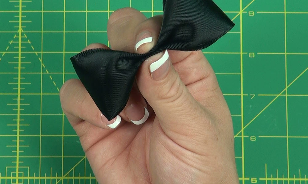 Woman making a Bow Tie Bow