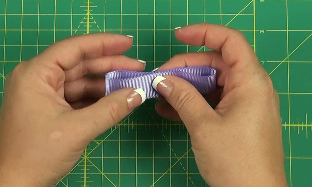 Woman making a Tailored Bow