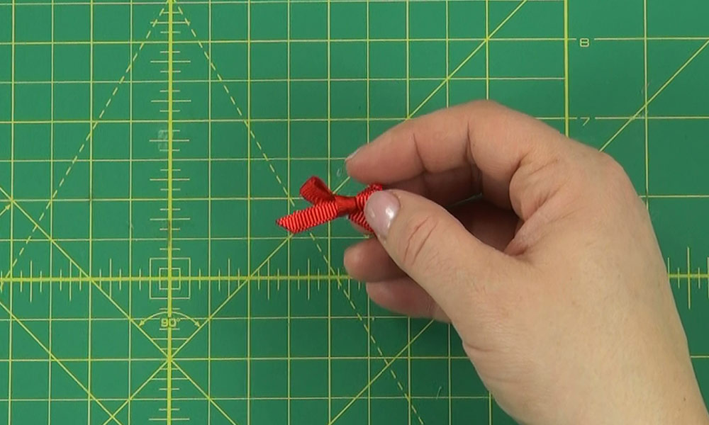 Woman making a Christmas Tree Hair Clip