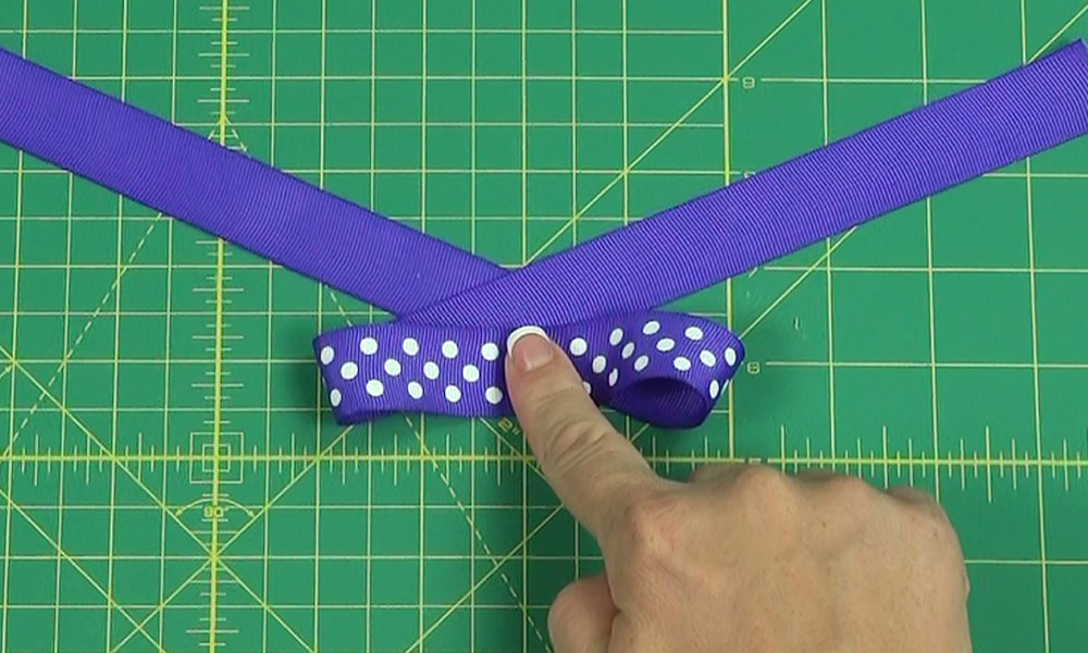 Woman making a Tails Down Bow